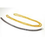A white metal necklace approx 16'' long, together with a bead necklace 52'' long (2) Please Note -