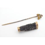 A late 19thC / early 20thC gilt metal stick pin set with gold nugget stone together with a Victorian