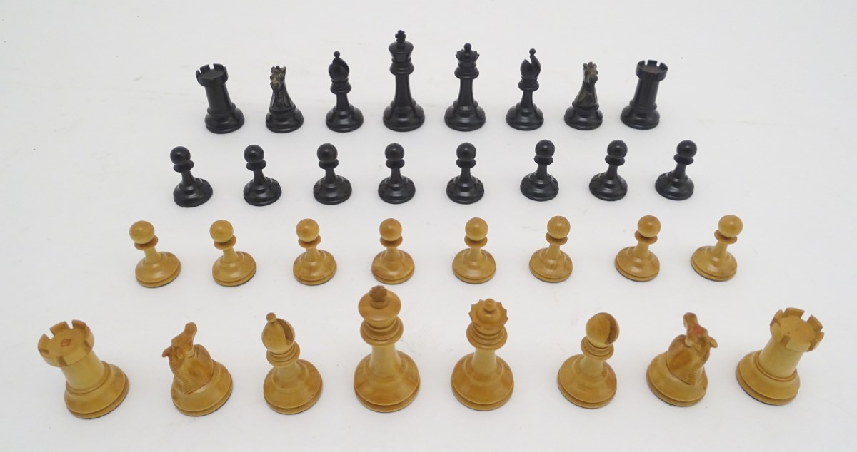 Toy: A set of Staunton chess pieces with weighted bases, two of the rooks and two of the knights