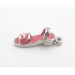 A silver novelty charm / pendant formed as a sandal shoe. 3/4" long Please Note - we do not make