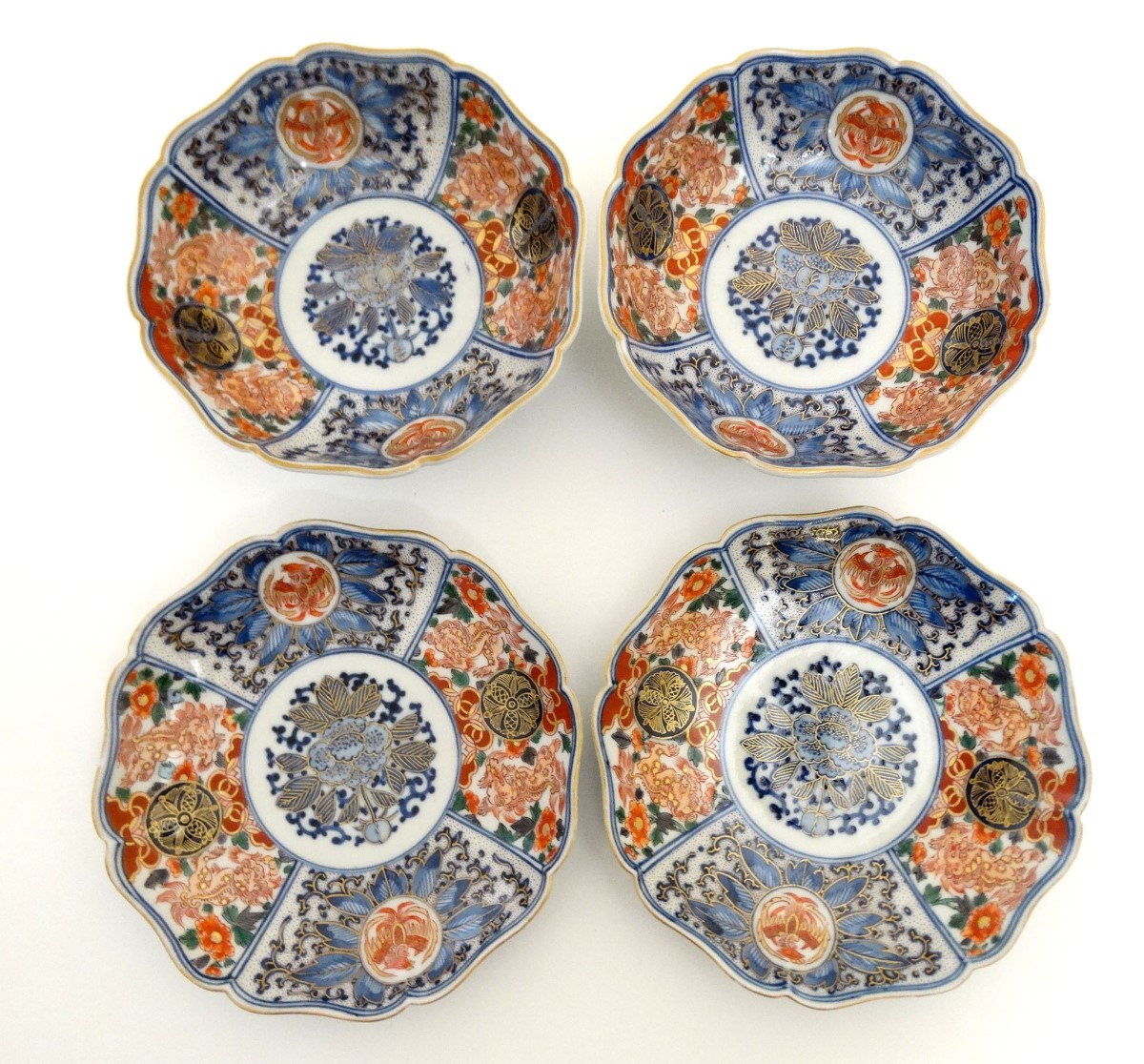 A pair of Japanese Imari plates and matching pair of bowls, having decorative floral and foliate - Image 5 of 7