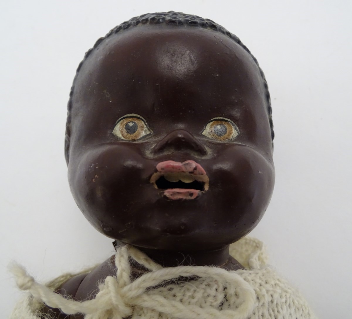 Toy: A black composite doll with articulated head, arms and legs, with modelled hair and painted - Image 5 of 7