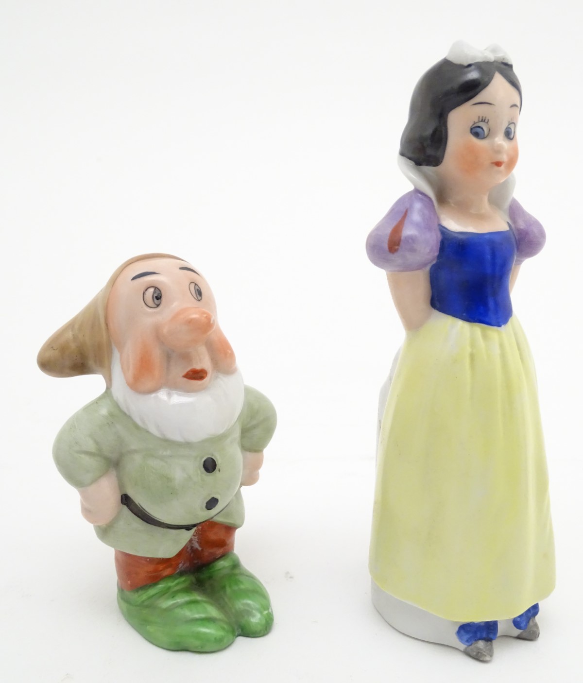 A mid-20thC ceramic novelty set of bud vases, formed as Snow White and the seven Dwarves. The - Image 6 of 9