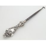 A silver handled button hook, Hallmarked Birmingham 1906. 8 1/2" long overall. Please Note - we do
