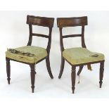 A pair of mahogany Regency side chairs, with shaped top rails, moulded supports and standing on
