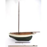 Toy: An early 20thC painted wooden toy boat / pond yacht. Approx. 22'' long. Please Note - we do not