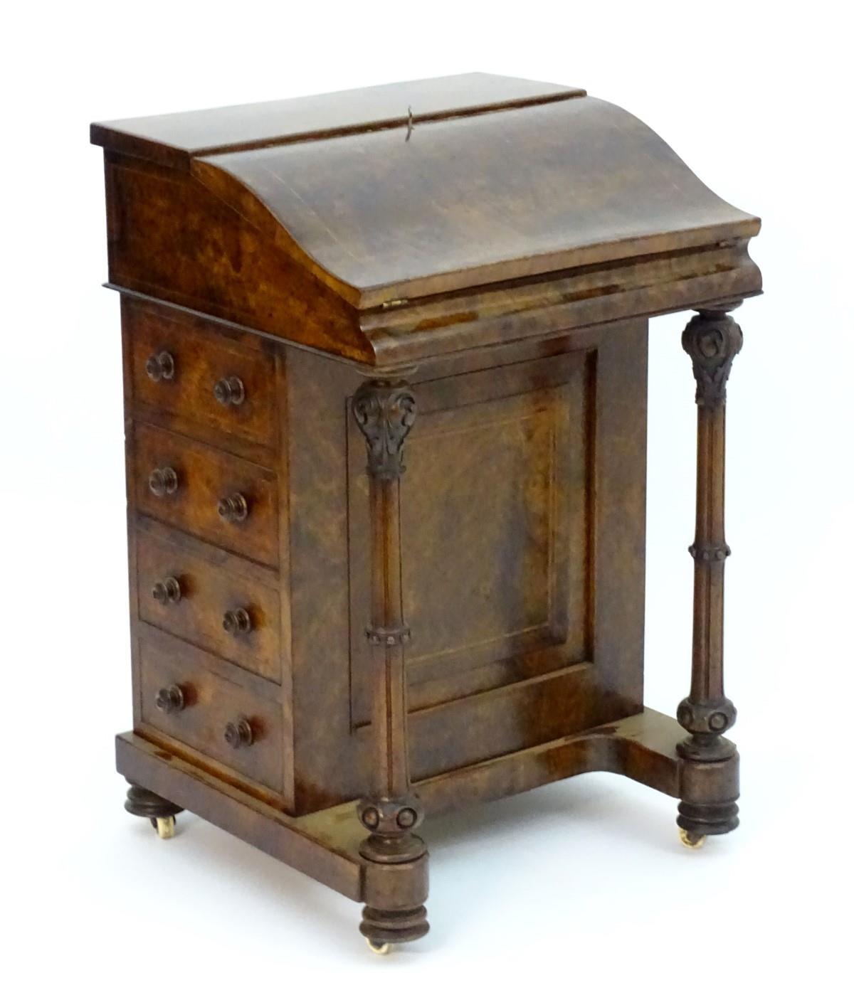 A mid 19thC burr walnut davenport with cross banding and decorative stringing, the top opening to - Image 2 of 11