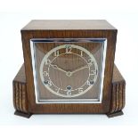 An Art Deco ?Westminster Chime? Bentima Mantle Clock of oak construction. Measuring 11 1/2" wide x 5