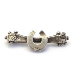 A Victorian silver brooch with horseshoe decoration. Hallmarked Chester 1898 Please Note - we do not