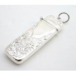 A white metal toothpick holder / needle case. 2 1/4" long Please Note - we do not make reference