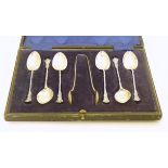 A set of 6 silver teaspoons hallmarked Chester 1900 together with associated sugar tongs