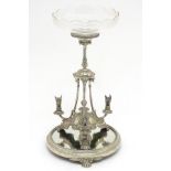 A late 19thC / early 20thC silver plate epergne / centrepiece, the central stand with associated cut