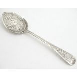 A Victorian silver preserve / pate spoon with engraved decoration. Hallmarked London 1889 maker John