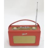 A late 20thC Roberts R250 portable radio, with red vinyl covering, serial number 271883 Please