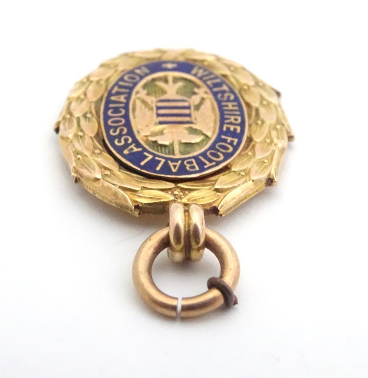A 9ct gold fob medal with enamelled Wiltshire Football Association emblem. Total weight 8g Please - Image 6 of 13