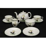 An Aynsley tea set in the pattern Wake Up, decorated with cockerels crowing before a rising sun.