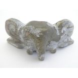 A carved jade toggle / netsuke modelled as a stylised elephant. Approx. 3" x 1 1/4" Please Note - we