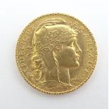 A French Republic 20 franc gold coin 1908, approximately 6.5g Please Note - we do not make reference