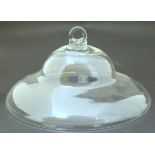 A 19thC clear glass smoke bell, of domed form with looped handle. 10" diameter Please Note - we do