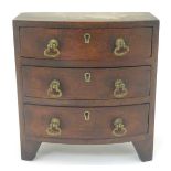 A Victorian apprentice piece formed as a bow fronted chest of drawers. 7 7/8'' high Please Note - we