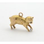 A gold novelty pendant charm formed as a cat / kitten. Marked 15ct. 3/4" long Please Note - we do