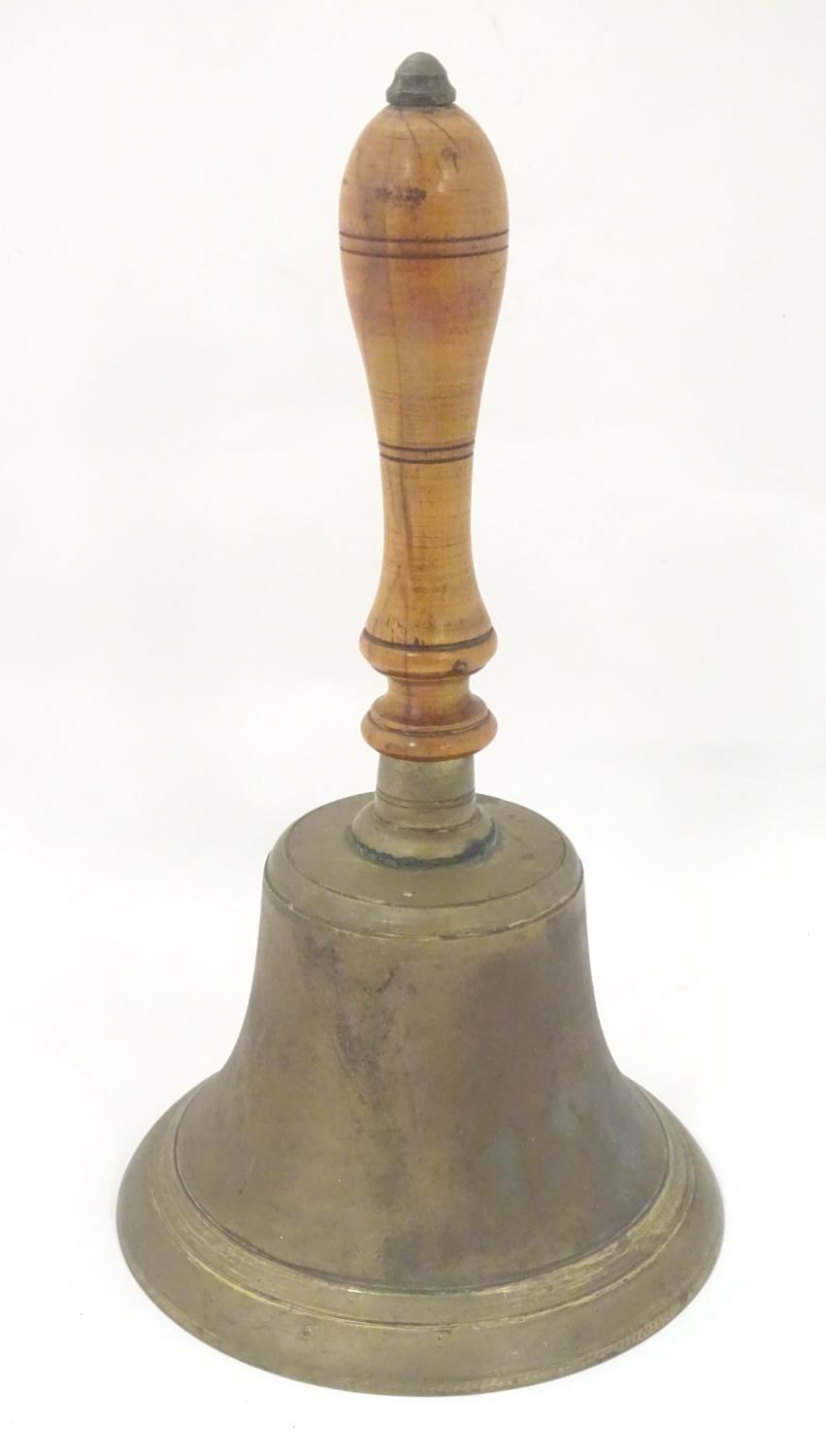 A 19th / 20thC large hand bell with a turned wooden handle and incised banded decoration. Approx. 14 - Bild 4 aus 8