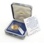 A boxed 2002 Golden Jubilee edition 22ct gold proof half sovereign coin. Approximately 4g Please