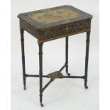 An early 19thC ebonised occasional table with a rectangular canted top having marquetry and