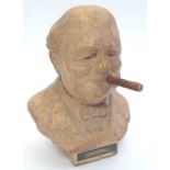 A mid-20thC novelty ceramic bar top lighter, in the form of a bust of Winston Churchill. The back