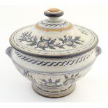 An Italian stoneware footed tureen of urn form with banded floral decoration. Signed under