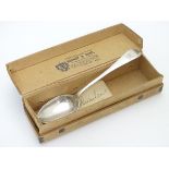 A silver teaspoon hallmarked Sheffield 1904 maker W S Savage & Co with a card box printed with
