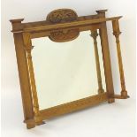 An early 20thC oak mantle mirror with a carved top above fluted and turned supports. 47" wide x