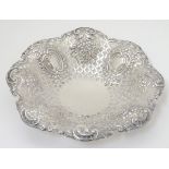 A silver dish with embossed and pierced decoration. Hallmarked Sheffield 1902 maker James Dixon &