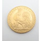 A French Republic 20 franc gold coin, 1908, approximately 6.5g Please Note - we do not make