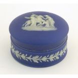 An early 19thC Wedgwood jasperware pot and cover depicting a classical scene with Pegasus and female