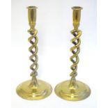 A pair of brass twist stem candlesticks. Approx. 12 1/4" high Please Note - we do not make reference