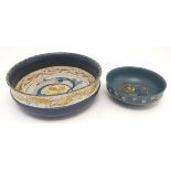 Two 20thC Norwegian wooden bowls with handpainted polychrome decoration of stylised scrolling