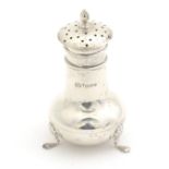 A silver pepperettes hallmarked Chester 1913 maker J & R Griffin Ltd. 3 1/2" high Please Note - we