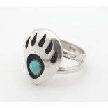 Vintage American Native Indian Navajo Zuni silver ring with ' bear paw' decoration to top set with