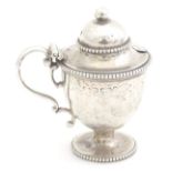A Victorian silver mustard pot of pedestal urn form with loop handle 3 1/2" high Please Note - we do