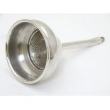 A silver plated wine funnel 5 1/2" long x 3" wide Please Note - we do not make reference to the