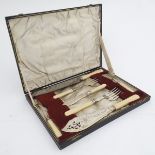 Cased serving items including bread knife, fish servers, pickle fork, butter knife etc. Silver plate