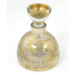 A 20thC squat formed scent bottle and stopper by LSA Poland, with burnished gold finish, 4 1/2''