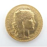 A French Republic 20 franc gold coin, 1908, approximately 6.5g Please Note - we do not make