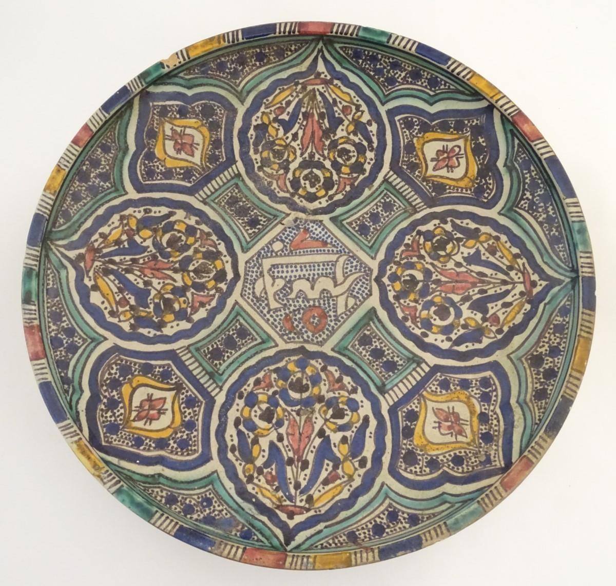 A Moroccan charger with panelled geometric designs with lotus and leaf shaped cartouches with - Image 4 of 19