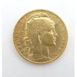 A French Republic 20 franc gold coin, 1908, approximately 6.5g Please Note - we do not make