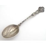 An American sterling silver souvenir spoon for Texas, decorated with Texan bull, lone star etc to