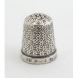 A silver thimble titled ' The Spa', no. 15. .Hallmarked Birmingham 1928 maker Henry Griffith &