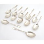 A set of 12 silver Hanoverian pattern dessert spoons with rats tail to bowls, hallmarked Sheffield