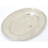 A small silver dish / plate of oval form. Hallmarked Sheffield 1910 maker William Hutton & Sons. 7''